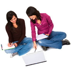 2 students collaborating on a laptop