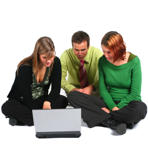 3 students clustered around a laptop