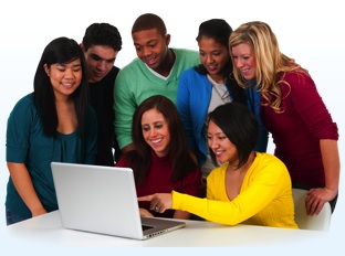 group of students around laptop computer